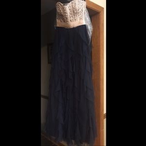 Formal two toned jeweled dress.